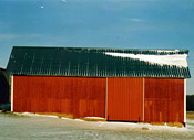 Smaller barn with new green steel roof replacement
